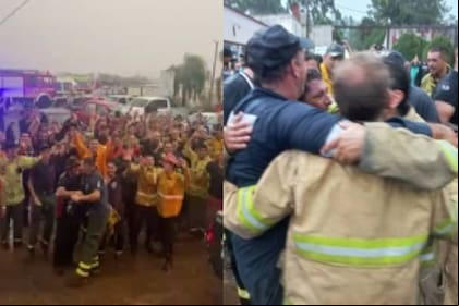 Bomberos que luchan contra el fuego festejaron la caída de lluvia (Foto captura)
