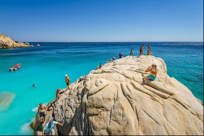 Ikaria Island, Seychelles Beach, Sporades/ Greece - 08 01 2017: Beautiful sunny coast view to a amazing paradise holiday bay with crystal clear blue water sandy beach for sunbathing swimming relaxing