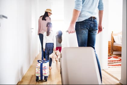 Young family with two children going on a holiday.